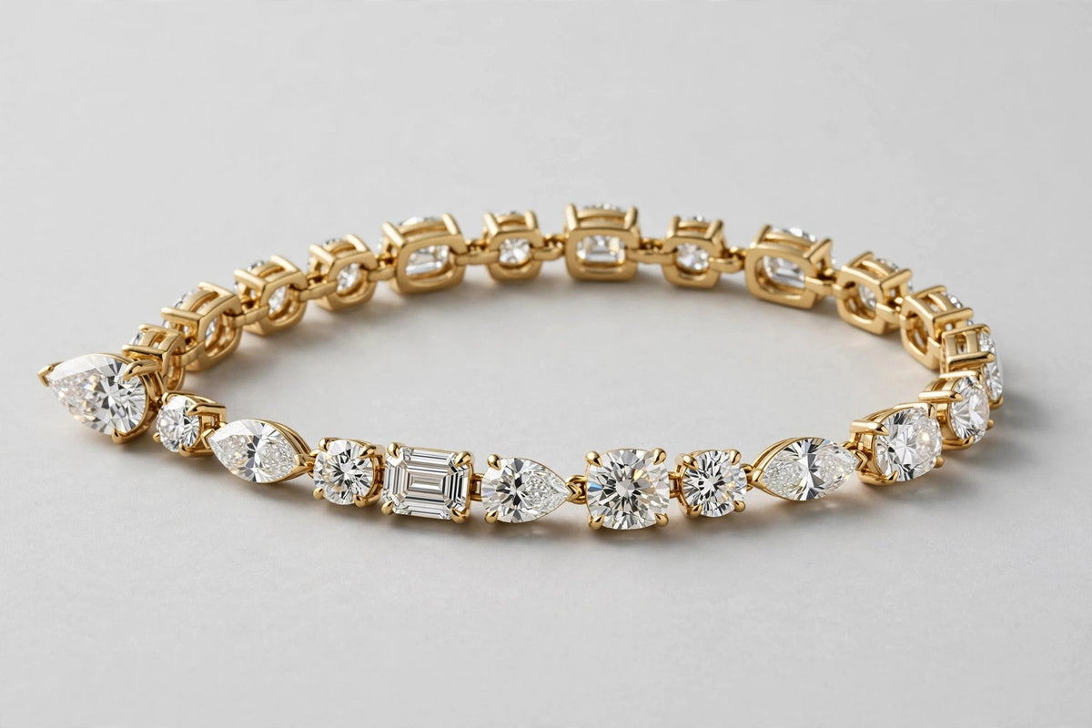 LAB MULTISHAPE W/PEAR TENNIS BRACELET 7.55CT 14KY 8.95G
